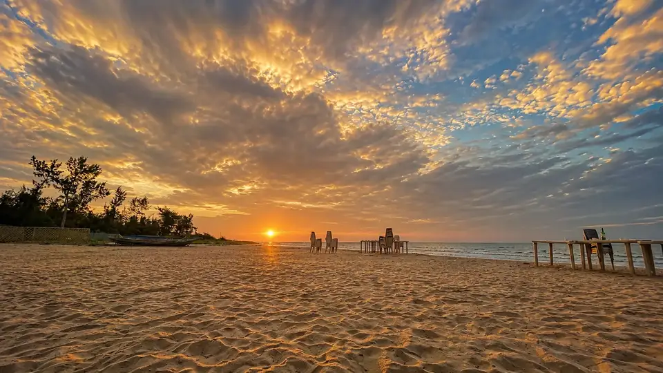 Golden sunset by the beach near MYRA Golden Beach Resort